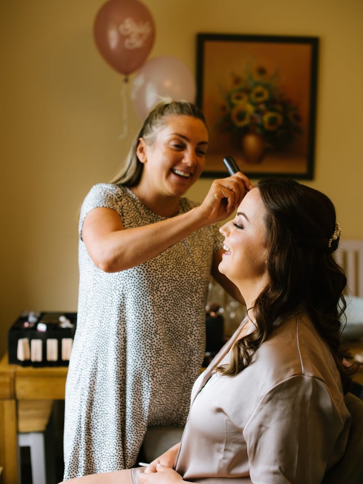 Bride getting ready with Beautilicious makeup artist